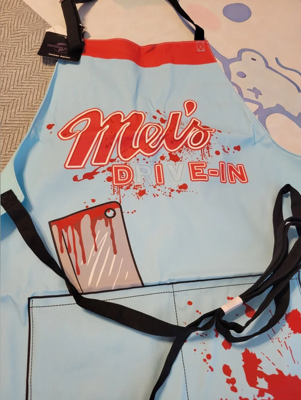 Mel's Die In HHN Apron Unisex